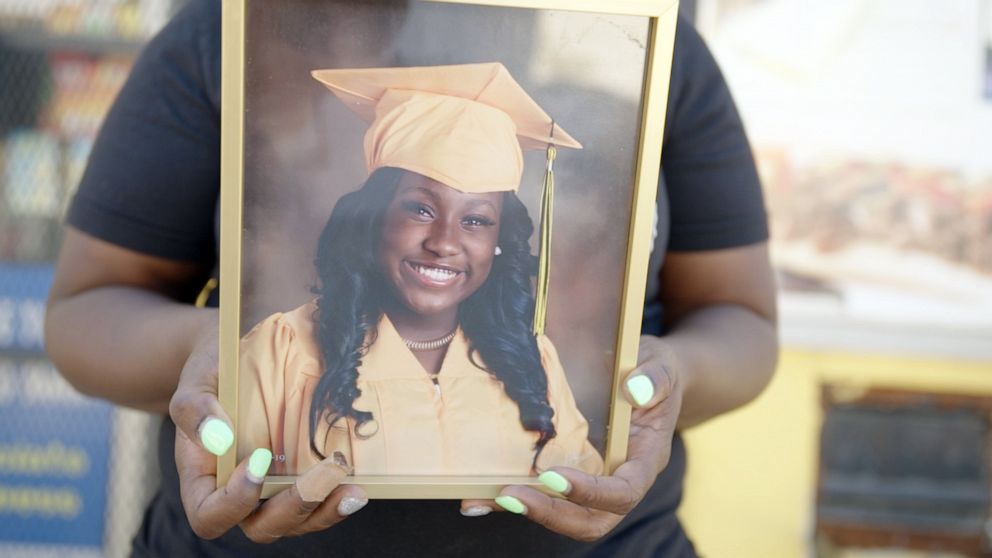 PHOTO: Nyisha Beemon holds a framed photo of her daughter, Jaya, who died from gun violence in February 2020.