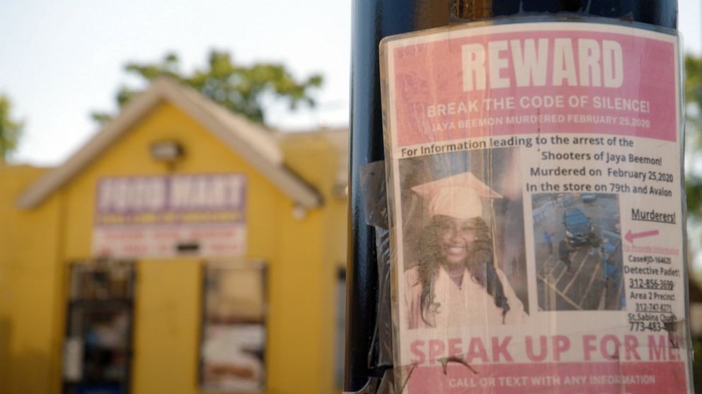 PHOTO: A reward poster to help identify the gunmen involved in the 2020 shooting that killed 18-year-old Jaya Beemon and wounded four others is taped to a post near the food mart where the shooting occurred.