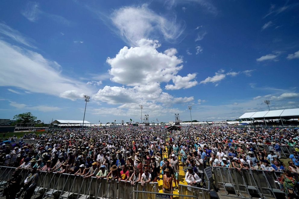 PHOTO: Crowds listen as Big Sam's Funky Nation performs at the New Orleans Jazz & Heritage Festival in New Orleans, April 29, 2022.