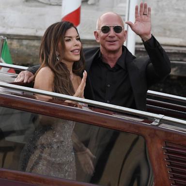 PHOTO: Jeff Bezos and Lauren Sanchez wave as they exit the Hotel Aman Wedding, June 28, 2025 in Venice, Italy.