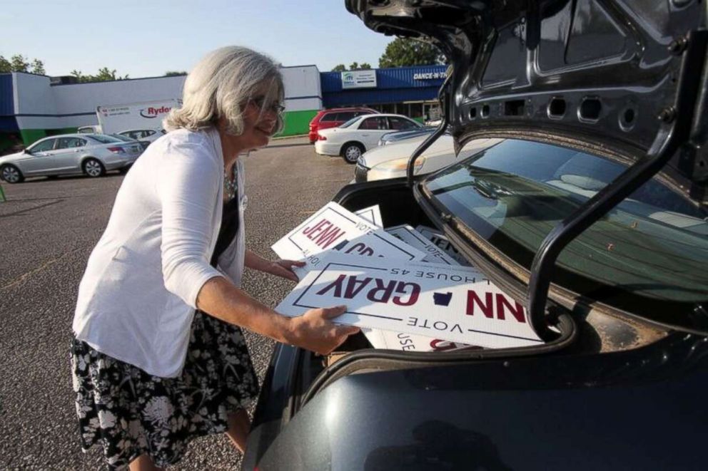 PHOTO: Jenn Gray loads campaign signs for her candidacy for the Alabama state legislature.