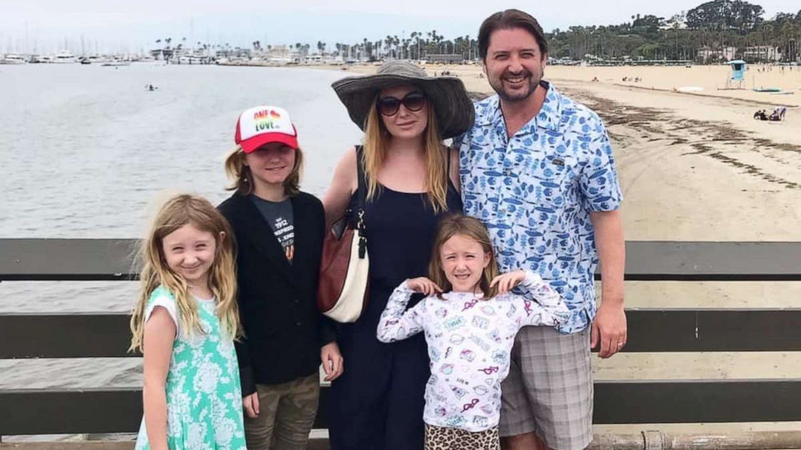 PHOTO: Jenna Karvunidis poses with her husband and their three daughters.