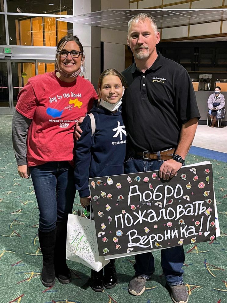 PHOTO: Jennifer and Clete Mitchell, of Oregon, pose with a 12-year-old Ukrainian girl whom they are in the process of adopting.