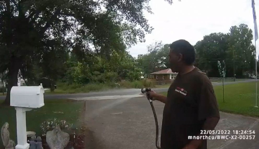 PHOTO: Pastor Michael Jennings was watering his neighbor's flowers while they were out of town when he was reported to the police for suspicious activity.