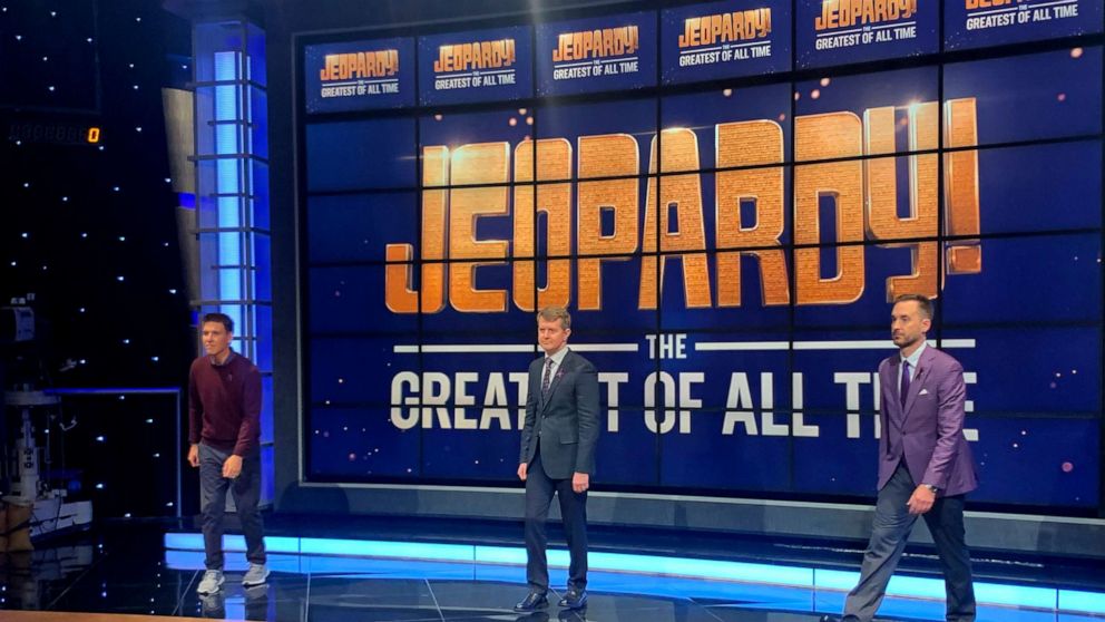 PHOTO: Ken Jennings, Brad Rutter and James Holzhauer pose on the set of "Jeopardy! The Greatest of All Time."
