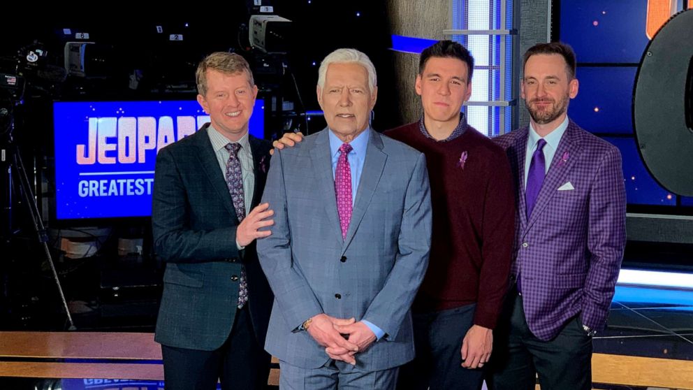 PHOTO: Ken Jennings, Brad Rutter and James Holzhauer pose with Alex Trebek on the set of "Jeopardy! The Greatest of All Time."