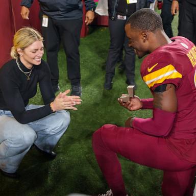 PHOTO: Mikaela Worley accepts the proposal from safety Jeremy Reaves #39 of the Washington Commanders on the field following an NFL football game against the Atlanta Falcons at Northwest Stadium in Landover, Md., Dec. 29, 2024.