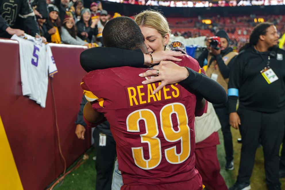 PHOTO: Mikaela Worley hugs her fiance safety Jeremy Reaves #39 of the Washington Commanders after he proposed on the field following an NFL football game against the Atlanta Falcons at Northwest Stadium in Landover, Md., Dec. 29, 2024.