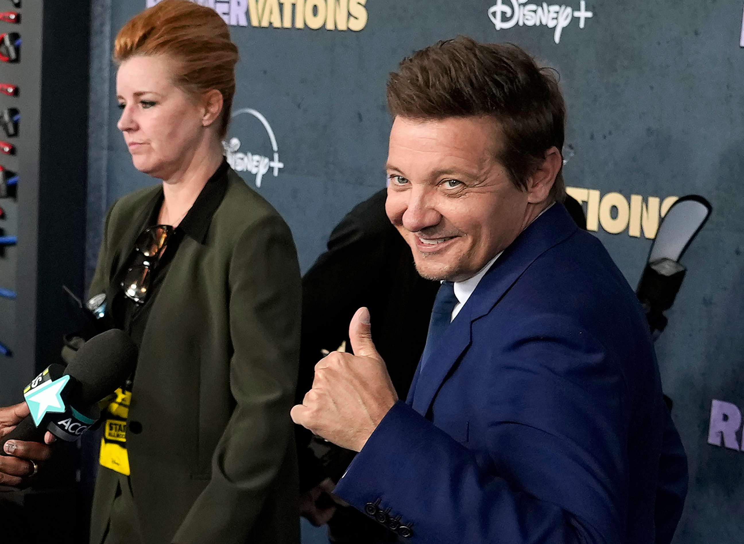 PHOTO: Jeremy Renner, the host and executive producer of "Rennervations," gives a thumbs-up to photographers at the premiere of the four-part Disney+ docuseries, April 11, 2023 in Los Angeles.