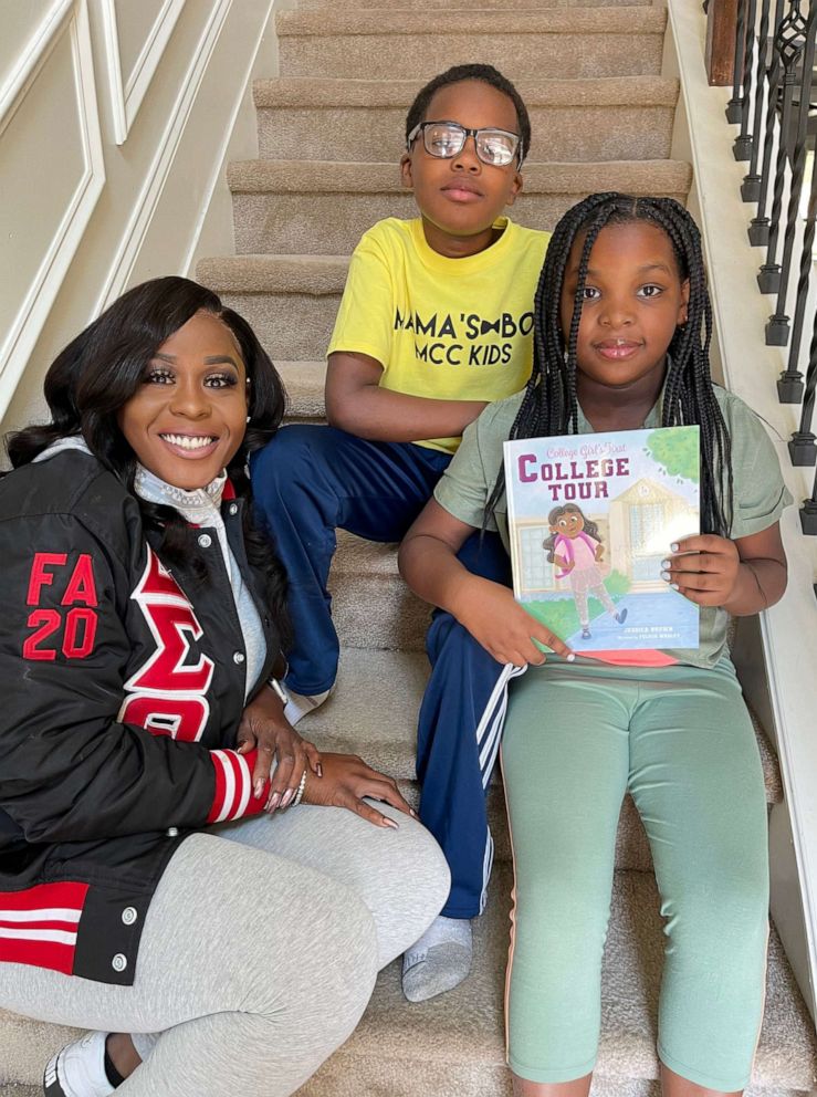 PHOTO: Jessica Brown reads her book College Girl's First College Tour to children.