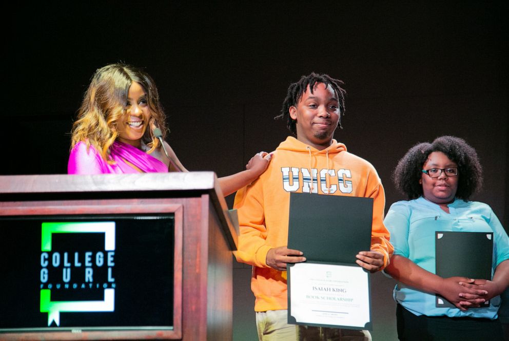 PHOTO: Jessica Brown presents students with scholarships.