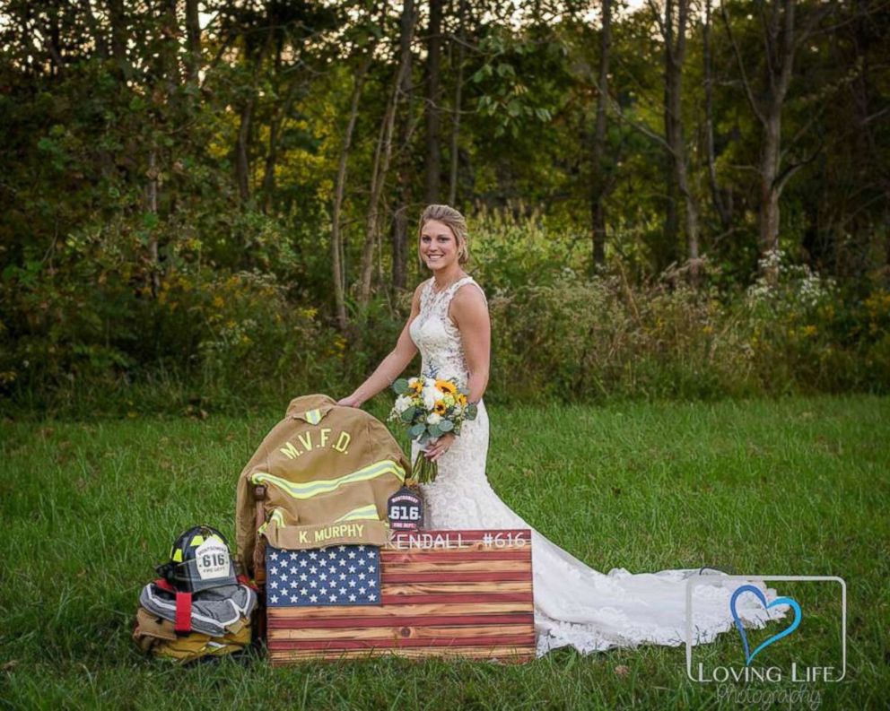 PHOTO: Jessica Padgett standing by Kendall Murphy’s firefighter gear at Glendale State Park, Sept. 29, 2018.