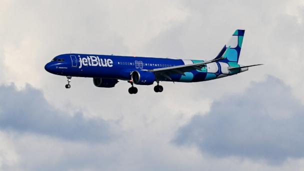 In this Feb. 7, 2025, file photo, a JetBlue Airways plane lands at San Francisco International Airport (SFO) in San Francisco, Calif.