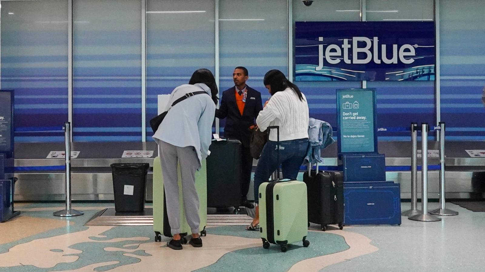 PHOTO: People check in their bags at the JetBlue Airways counter in the Fort Lauderdale-Hollywood International Airport, Jan. 31, 2024, in Fort Lauderdale, Fla.