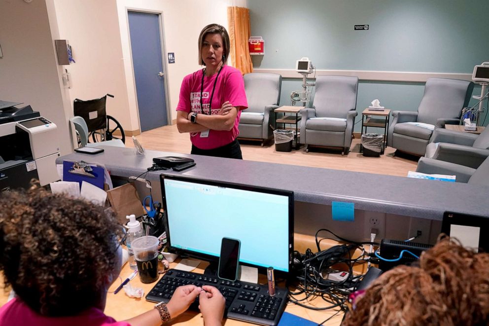 PHOTO: In this June 30, 2022, file photo, Dr. Jill Gibson, medical director for Planned Parenthood Arizona, speaks with her staff at the Planned Parenthood facility in Tempe, Ariz.