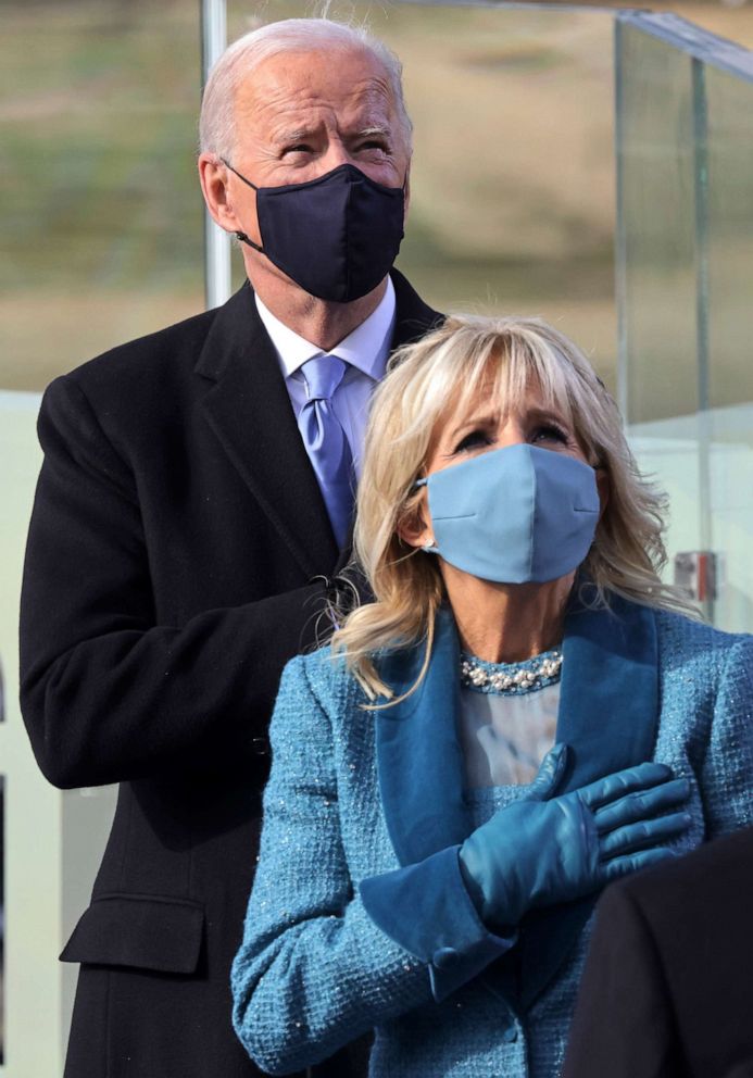 PHOTO: President-elect Joe Biden and his wife Jill look on during the national anthem during his inauguration as the 46th President of the United States on the West Front of the U.S. Capitol, Jan. 20, 2021, in Washington.