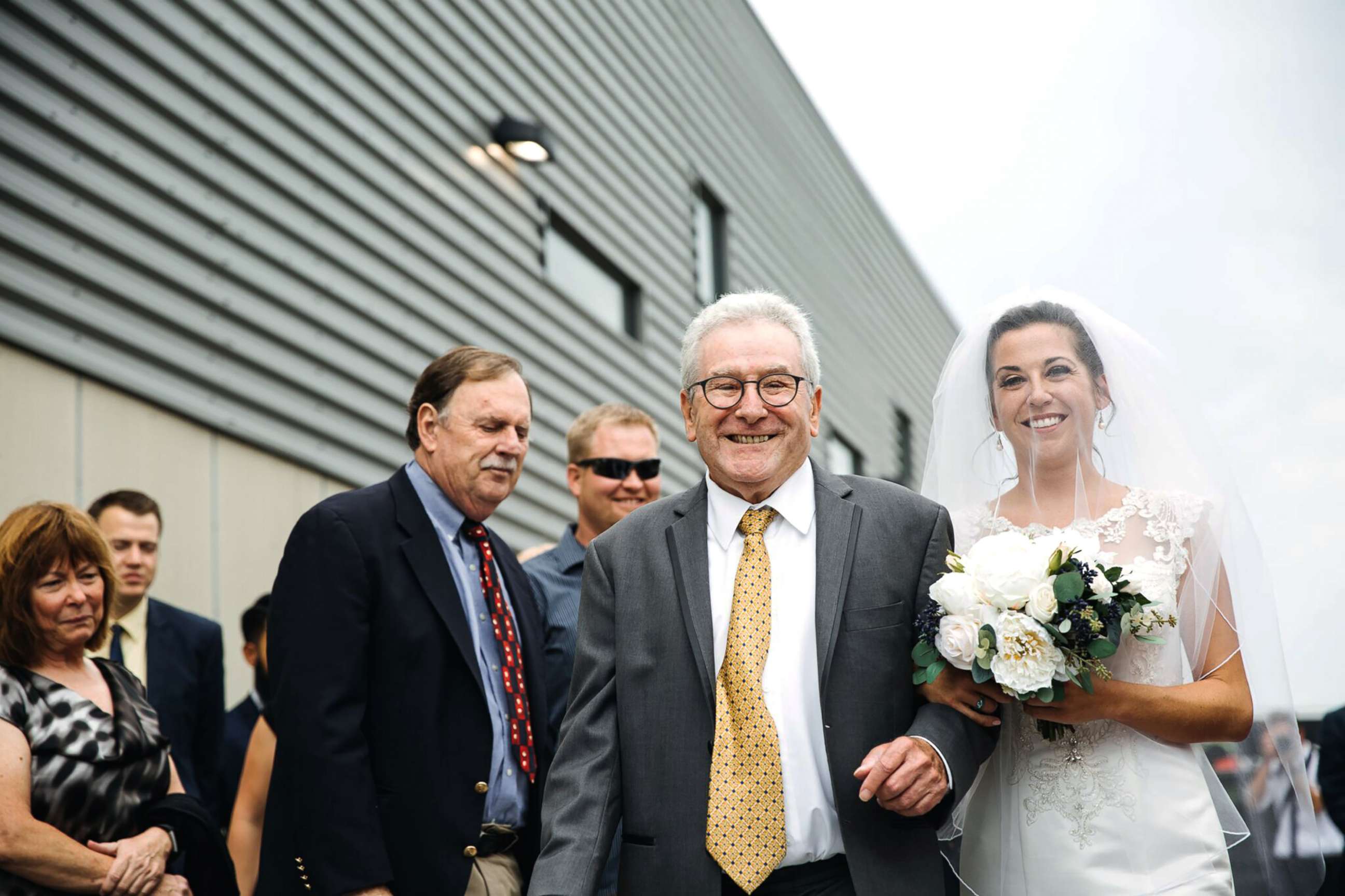 PHOTO: Jim Stamp, 70, accompanied Gina Ross down the aisle using his cane before surprising her by ditching it during their father-daughter dance.