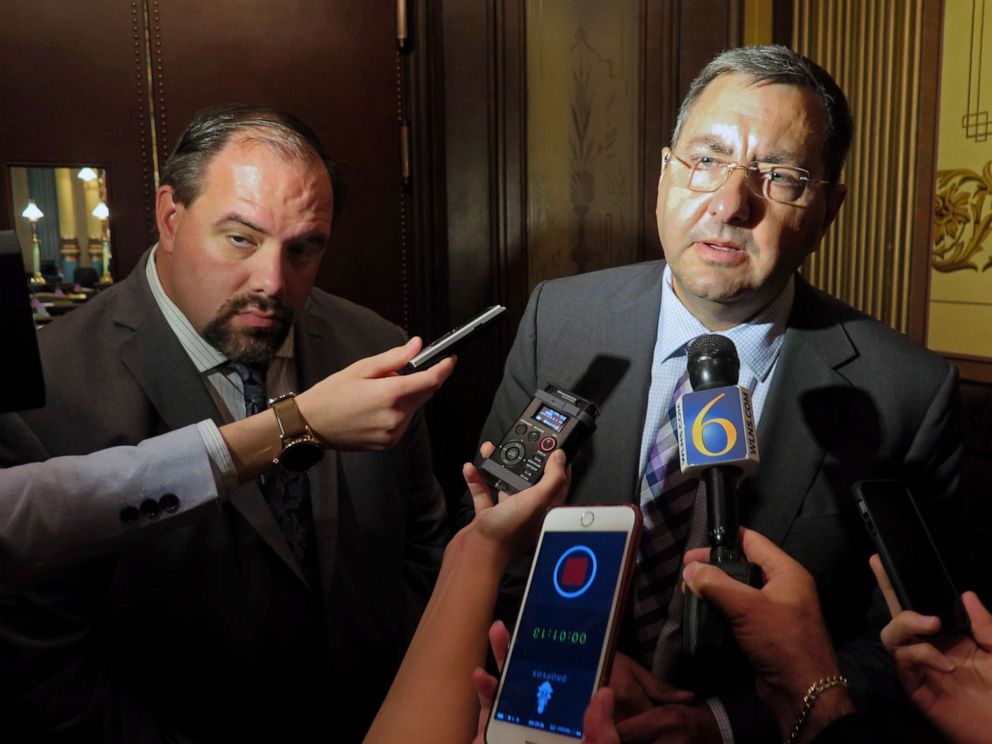 PHOTO: Sen. Jim Stamas, right, and Senate Minority Leader Jim Ananich speak to reporters about the release of their panel's report and recommendations related to the Flint water crisis outside the Michigan Senate chamber, Oct. 19, 2016, in Lansing, Mich. 