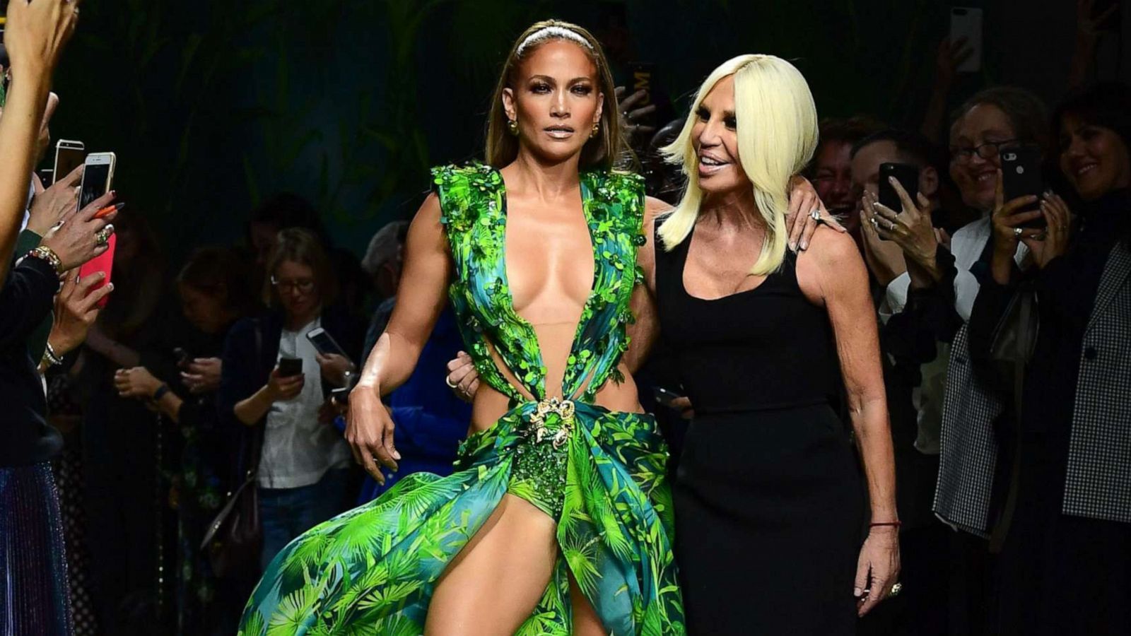 PHOTO: Italian fashion designer Donatella Versace and Jennifer Lopez pose following the presentation of Versace's Women's Spring Summer 2020 collection in Milan, Sept. 20, 2019.