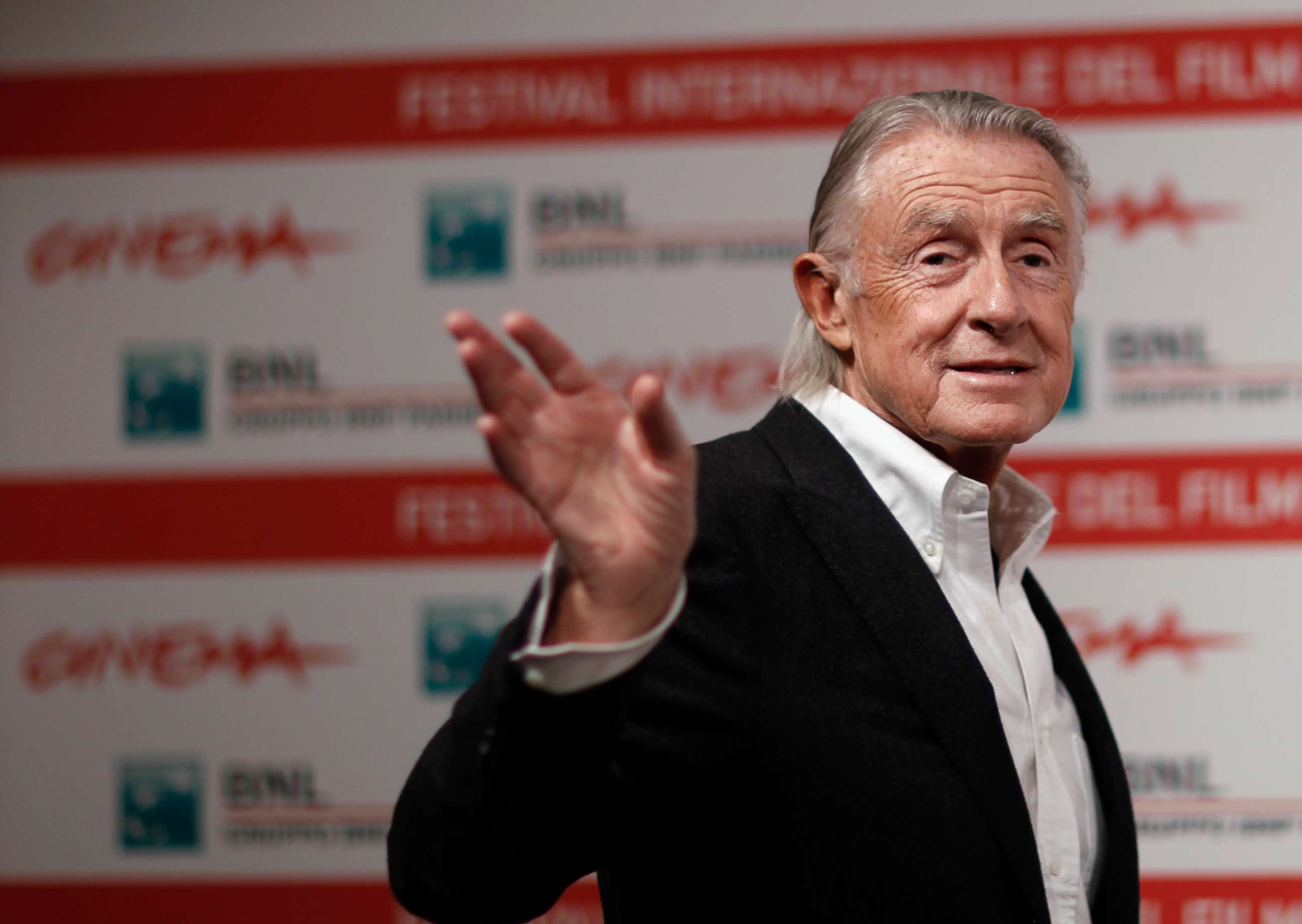 PHOTO: Director Joel Schumacher waves as he poses during a photo call at a film festival in Rome, Nov. 3, 2011.