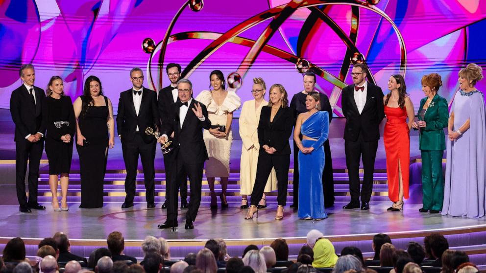 PHOTO: John Oliver, accompanied by crew, receives the Best Oustanding Scripted Variety Series award for "Last Week Tonight with John Oliver" at the 76th Primetime Emmy Awards, Sept. 15, 2024, in Los Angeles.