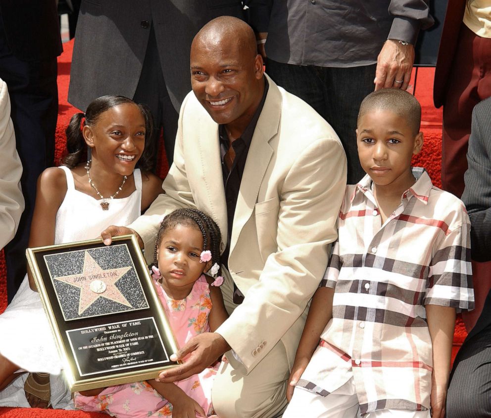 PHOTO: John Singleton with his children, Justice, Cleo and Massai during the ceremony honoring with a star on the Hollywood Walk of Fame, in Hollywood, Calif, Aug. 26, 2003.