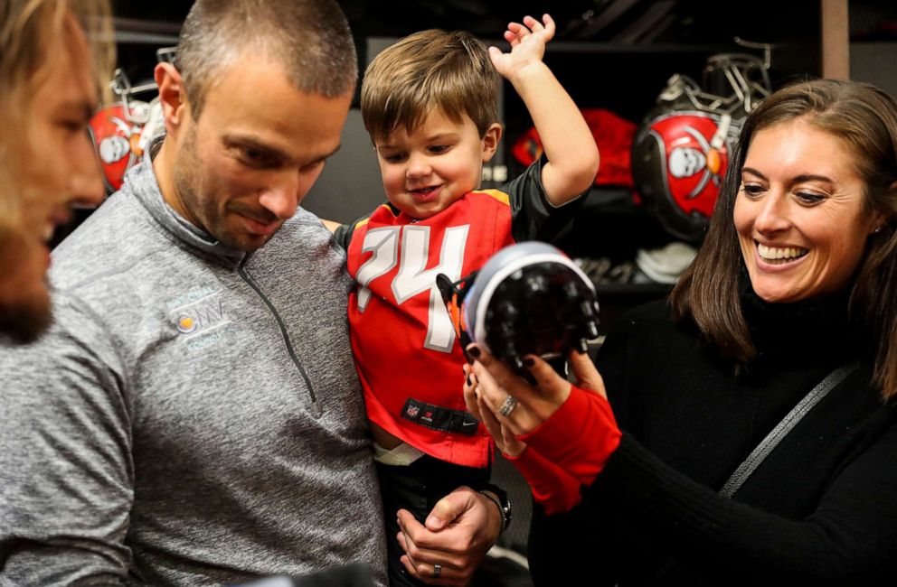 PHOTO: In this Nov. 28, 2018, file photo, Tampa Bay Buccaneers player Ali Marpet shows off his cleats from the My Cause, My Cleats initiative to John Spytek, Thomas Spytek, and Kristen Spytek before practice at One Buc Place in Tampa, Fla.