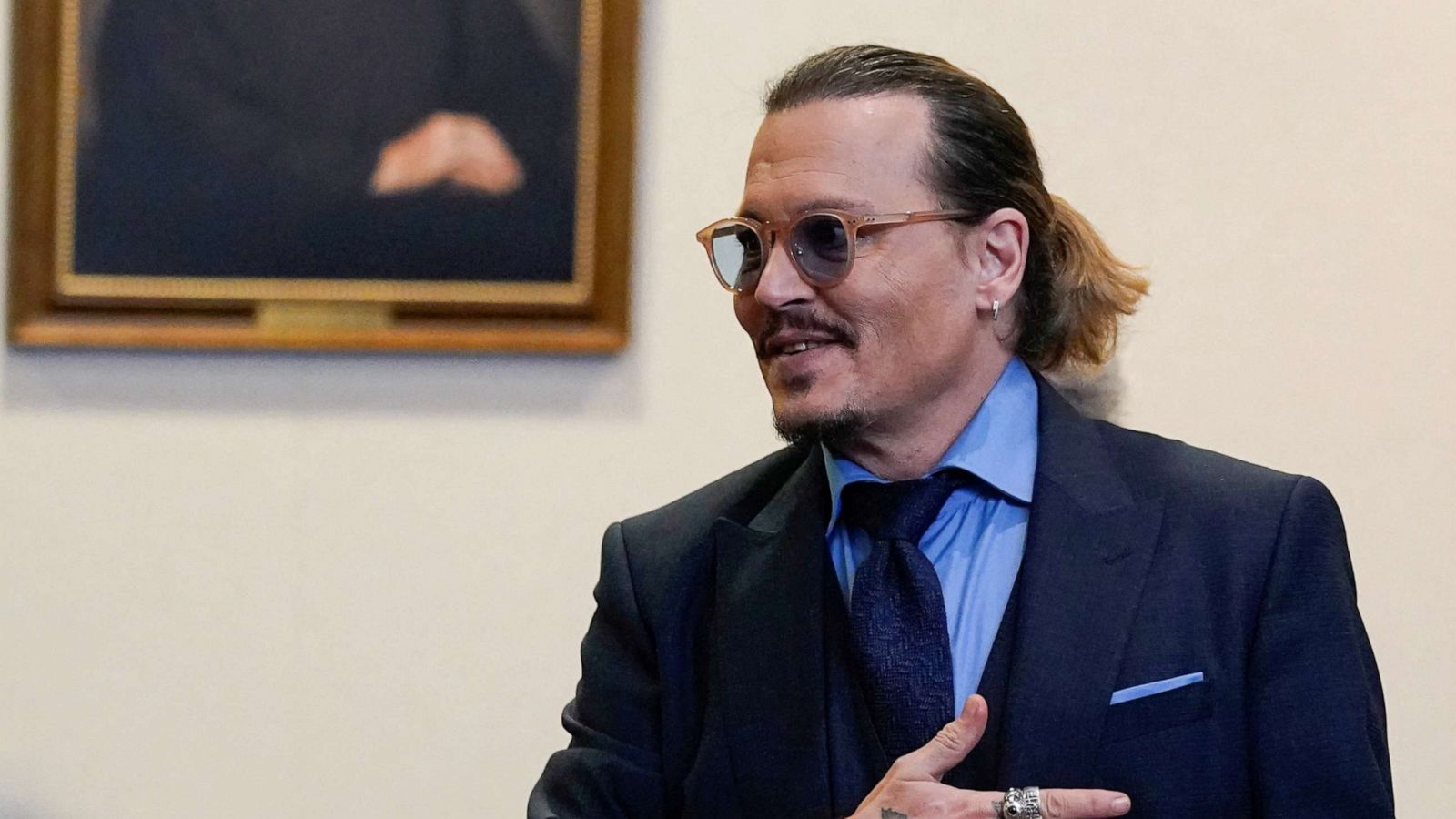 PHOTO: Johnny Depp gestures to spectators in court after closing arguments during his defamation case against ex-wife Amber Heard at the Fairfax County Circuit Courthouse in Fairfax, Virginia, May 27, 2022.