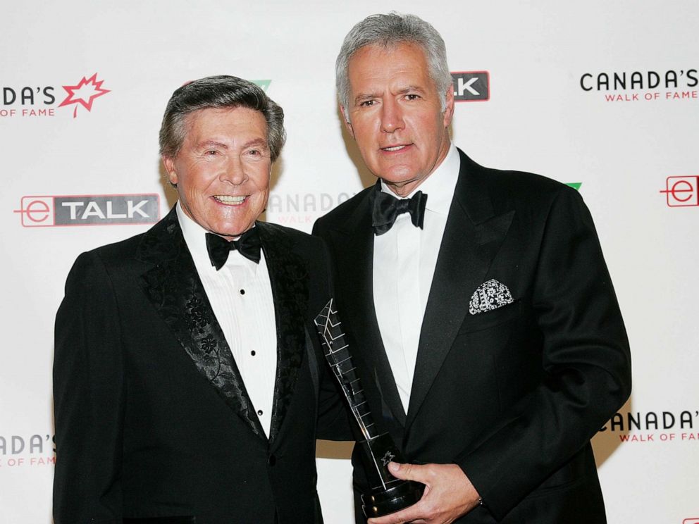 PHOTO: Presenter Johnny Gilbert and honoree Alex Trebek attend Canada's Walk Of Fame Gala at the HummingBird Centre June 3, 2006 in Toronto.