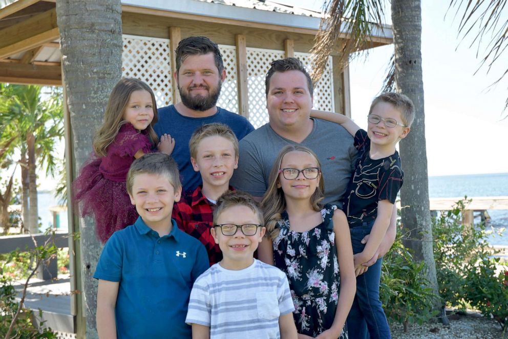 PHOTO: Dustin and Daniel Johnson, of Florida, are celebrating their first Father's Day after formally adoption six siblings in May 2023.