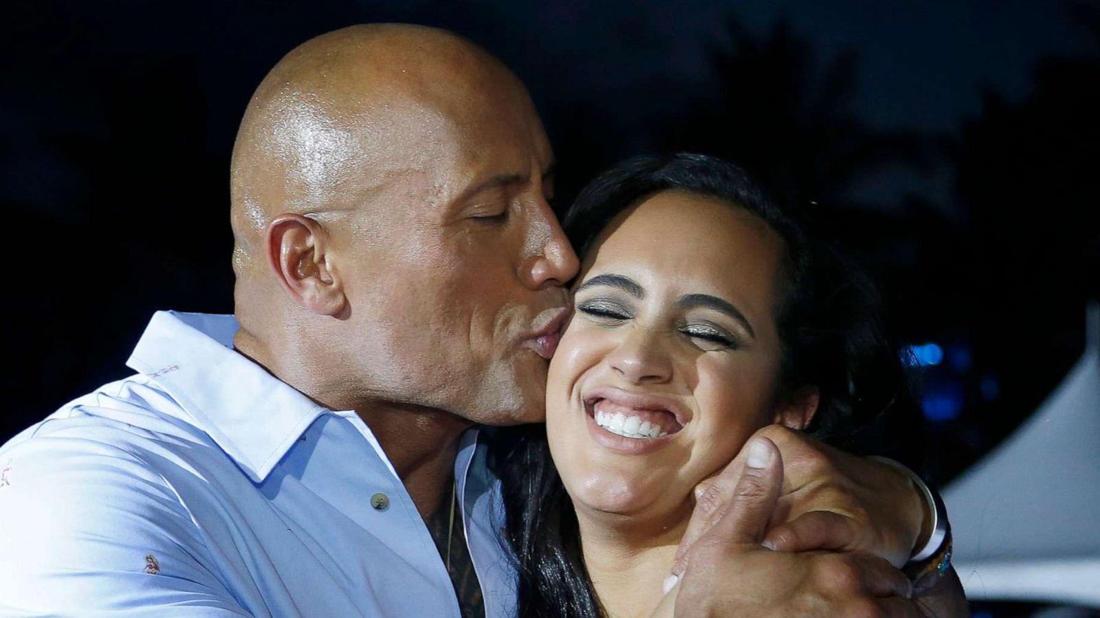 PHOTO: Actor Dwayne 'The Rock' Johnson kisses his daughter Simone at Paramount Pictures' World Premiere of 'Baywatch' in Miami Beach, Fla., May 13, 2017.