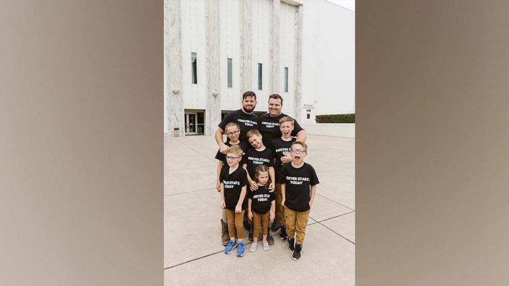 PHOTO: Dustin and Daniel Johnson, of Florida, are celebrating their first Father's Day after formally adoption six siblings in May 2023.