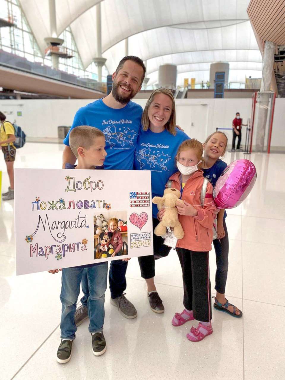 PHOTO: Matthew and Christy Johnson pose with two of their children and Margarita, an 8-year-old girl who lives in Ukraine.