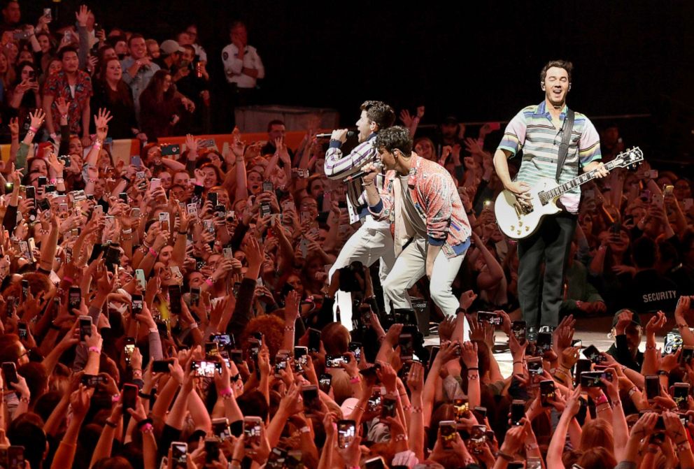 PHOTO: Nick Jonas, Joe Jonas, and Kevin Jonas of the Jonas Brothers perform onstage at The Armory on April 06, 2019 in Minneapolis, Minn.