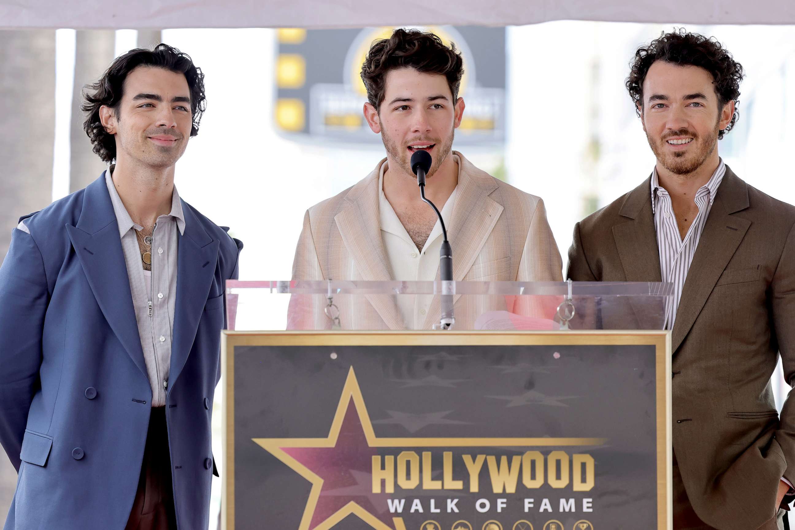 PHOTO: Joe Jonas, Nick Jonas, and Kevin Jonas of The Jonas Brothers speak onstage The Hollywood Walk of Fame star ceremony honoring The Jonas Brothers on January 30, 2023 in Hollywood, Calif.