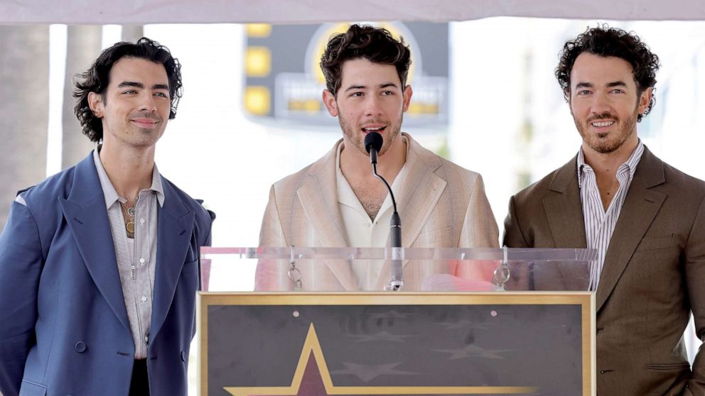 PHOTO: Joe Jonas, Nick Jonas, and Kevin Jonas of The Jonas Brothers speak onstage The Hollywood Walk of Fame star ceremony honoring The Jonas Brothers on January 30, 2023 in Hollywood, Calif.