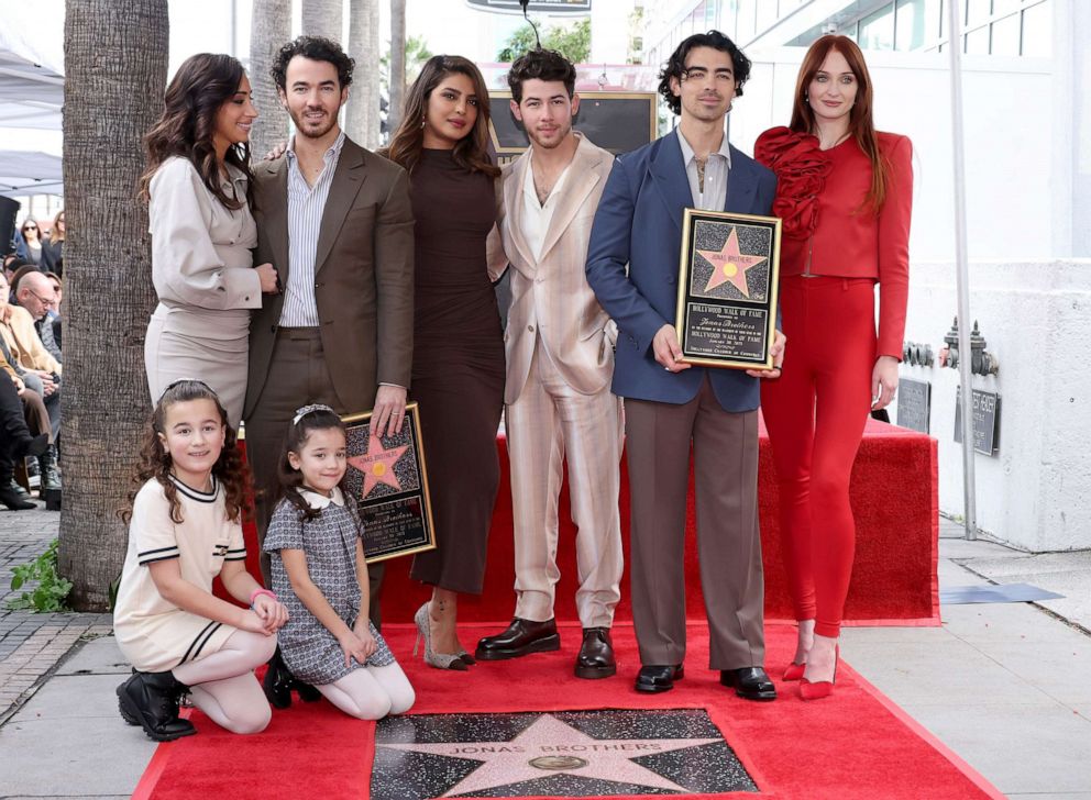 PHOTO: Danielle Jonas, Kevin Jonas, Priyanka Chopra, Nick Jonas, Joe Jonas, Sophie Turner, and Alena Rose Jonas and Valentina Angelina Jonas attend The Hollywood Walk of Fame star ceremony, Jan. 30, 2023 in Hollywood, California.