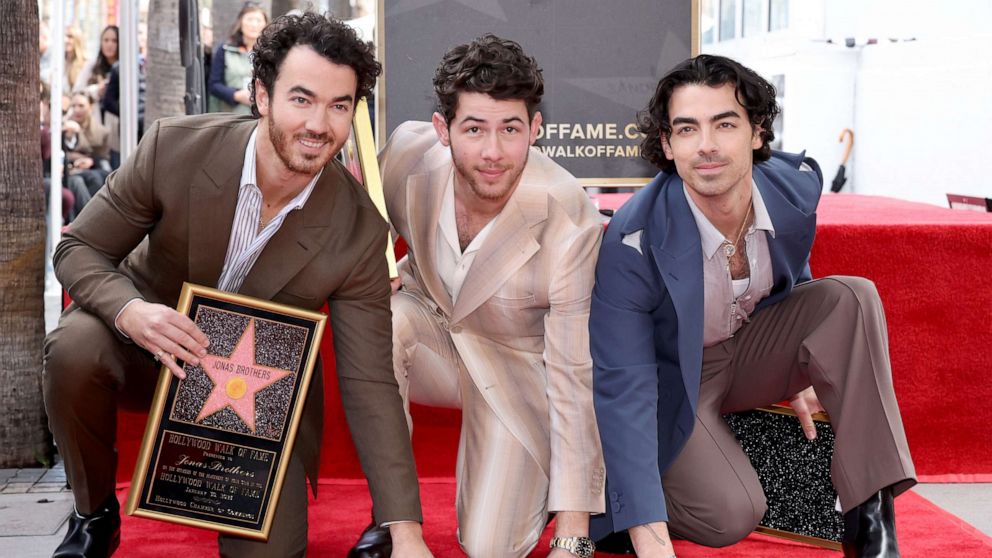 PHOTO: Kevin Jonas, Nick Jonas, and Joe Jonas of The Jonas Brothers attend The Hollywood Walk of Fame star ceremony honoring The Jonas Brothers on January 30, 2023 in Hollywood, California.