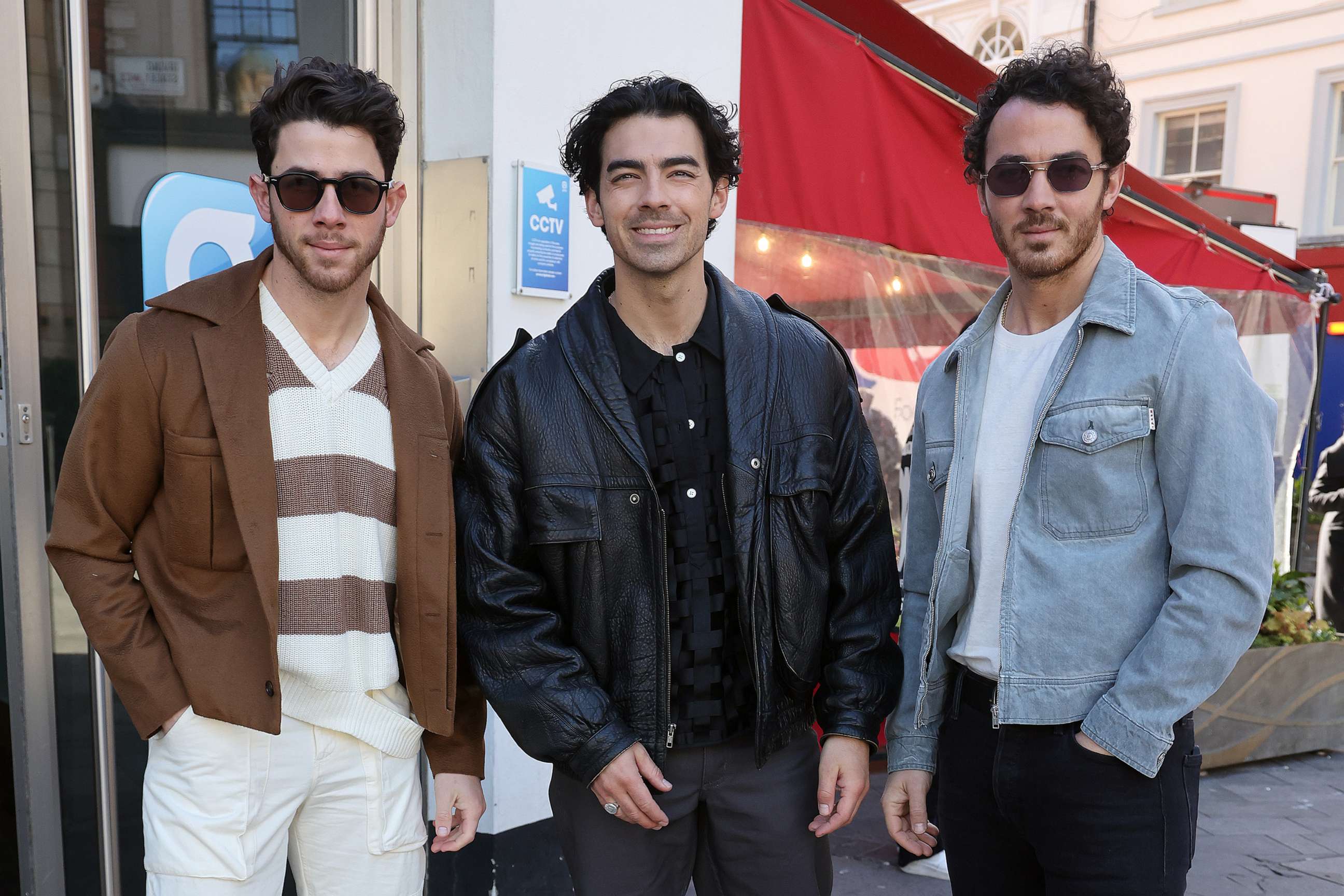 PHOTO: Nick Jonas, Joe Jonas and Kevin Jonas from the 'Jonas Brothers' arriving at Global Radio Studios to promote their new single 'Waffle House,' April 11, 2023, in London.