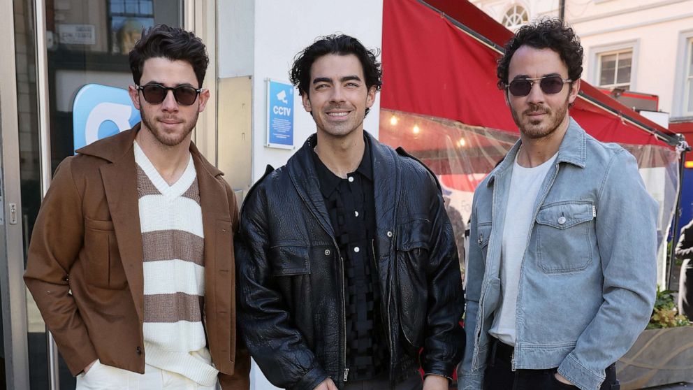 PHOTO: Nick Jonas, Joe Jonas and Kevin Jonas from the 'Jonas Brothers' arriving at Global Radio Studios to promote their new single 'Waffle House,' April 11, 2023, in London.