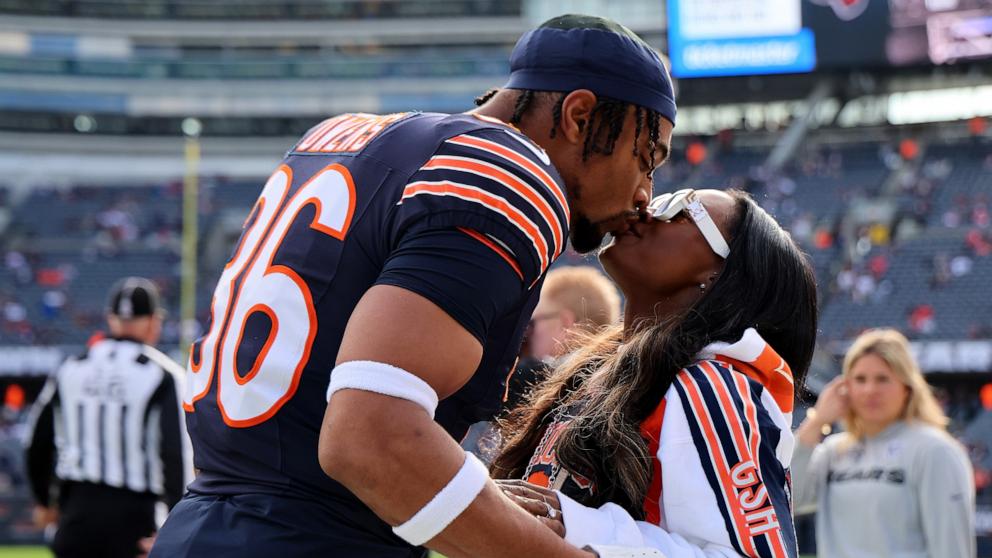 PHOTO: Jonathan Owens #36 of the Chicago Bears and Simone Biles kiss before the game against the New England Patriots at Soldier Field on Nov. 10, 2024 in Chicago.