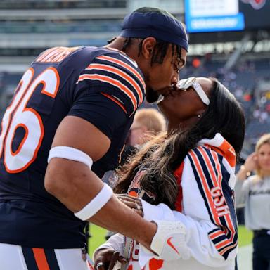 PHOTO: Jonathan Owens #36 of the Chicago Bears and Simone Biles kiss before the game against the New England Patriots at Soldier Field on Nov. 10, 2024 in Chicago.