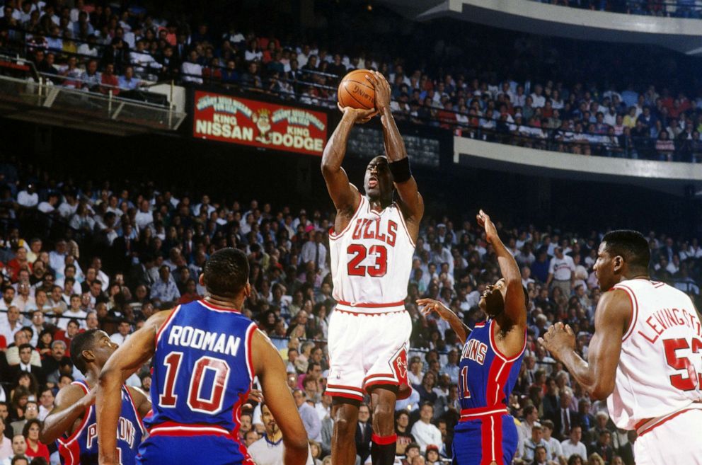 PHOTO: Michael Jordan jumps to shoot a basket against the Detroit Pistons at the Chicago Stadium during the 1991 NBA Playoffs in Chicago.