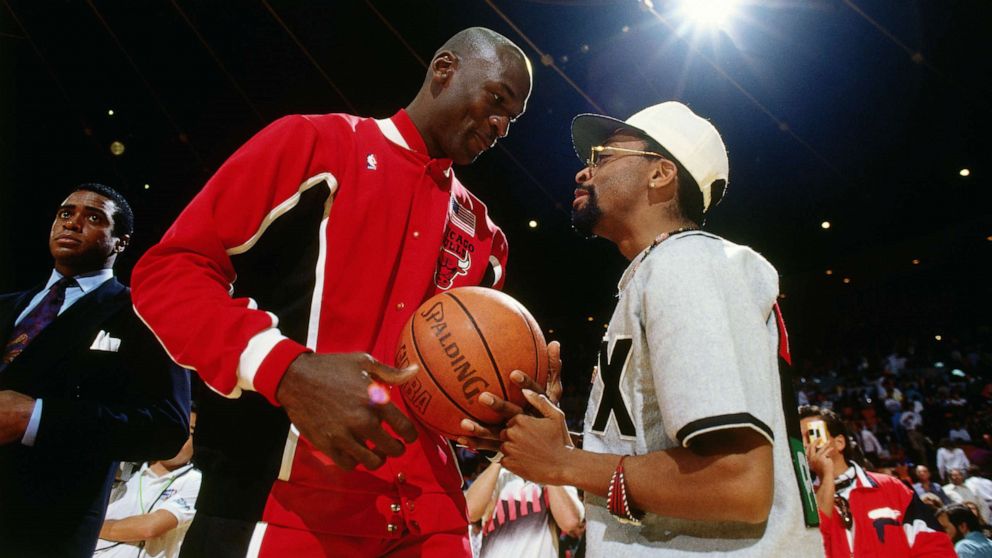 PHOTO: Michael Jordan talks with Spike Lee during Game Five of the 1991 NBA Finals on June 12, 1991 at the Great Western Forum in Inglewood, Calif.