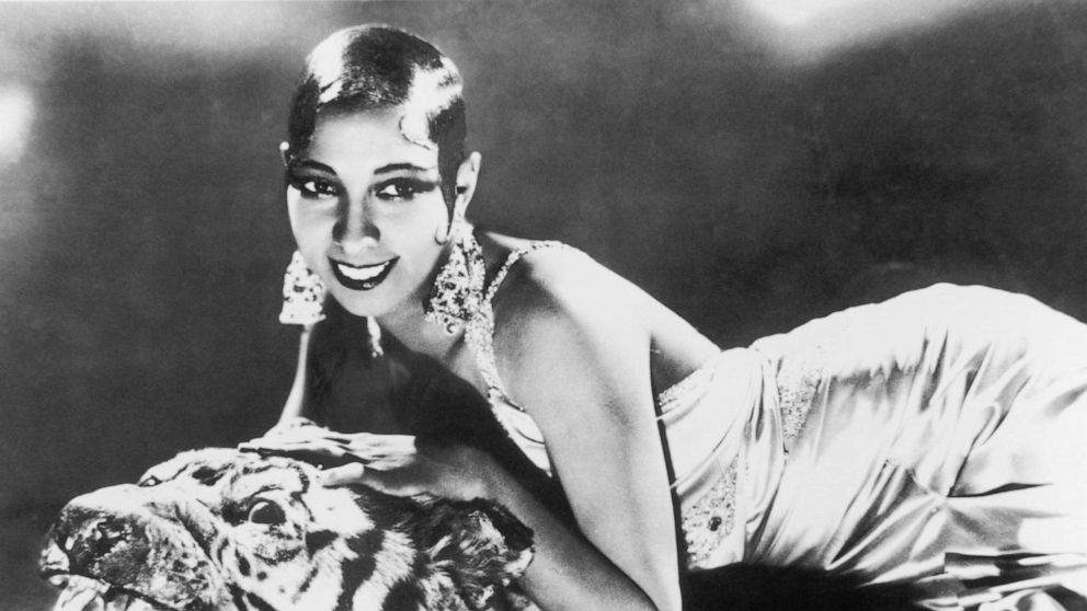 PHOTO: American-born singer and dancer Josephine Baker lying on a tiger rug in a silk evening gown and diamond earrings, circa 1925.