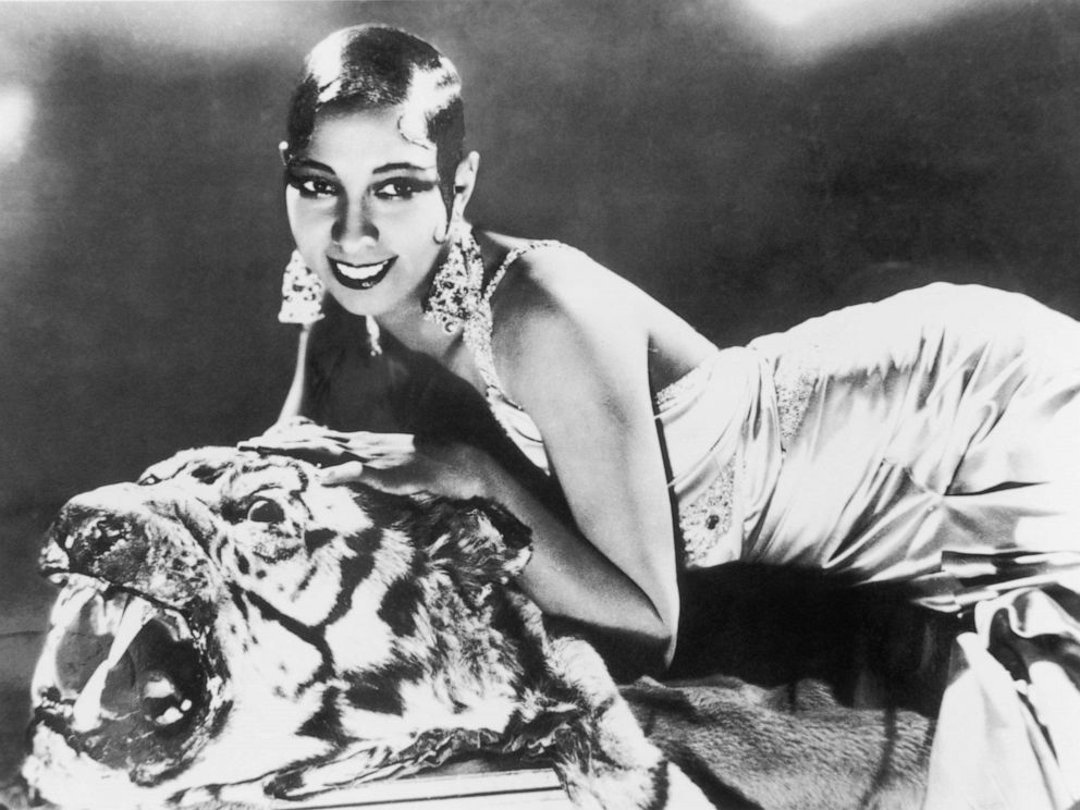 PHOTO: American-born singer and dancer Josephine Baker lying on a tiger rug in a silk evening gown and diamond earrings, circa 1925.
