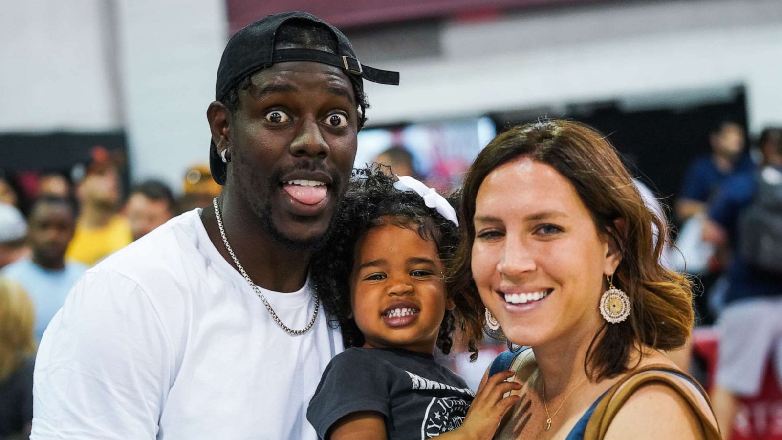 PHOTO: Jrue Holiday, daughter J.T. and wife Lauren Holiday smile during the NBA Summer League, July 06, 2019, in Las Vegas.