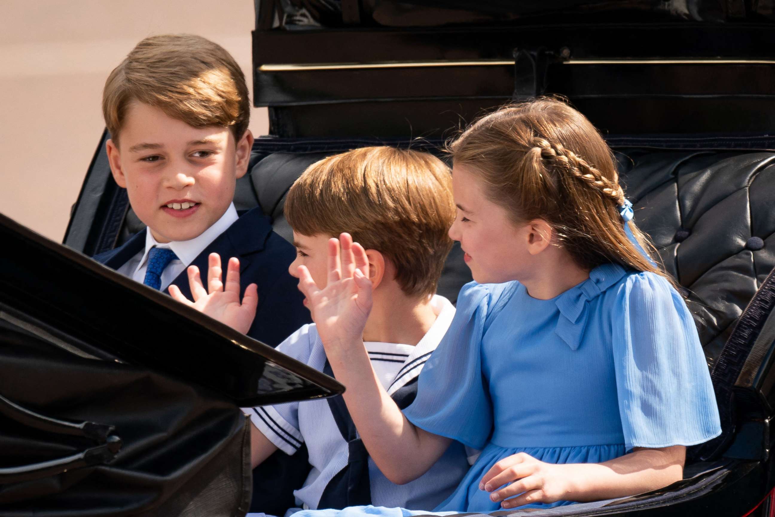 PHOTO: Prince George, Prince Louis and Princess Charlotte travel in a horse-drawn carriage during the Queen's Birthday Parade, the Trooping the Color, as part of Queen Elizabeth II's platinum jubilee celebrations, in London, June 2, 2022.