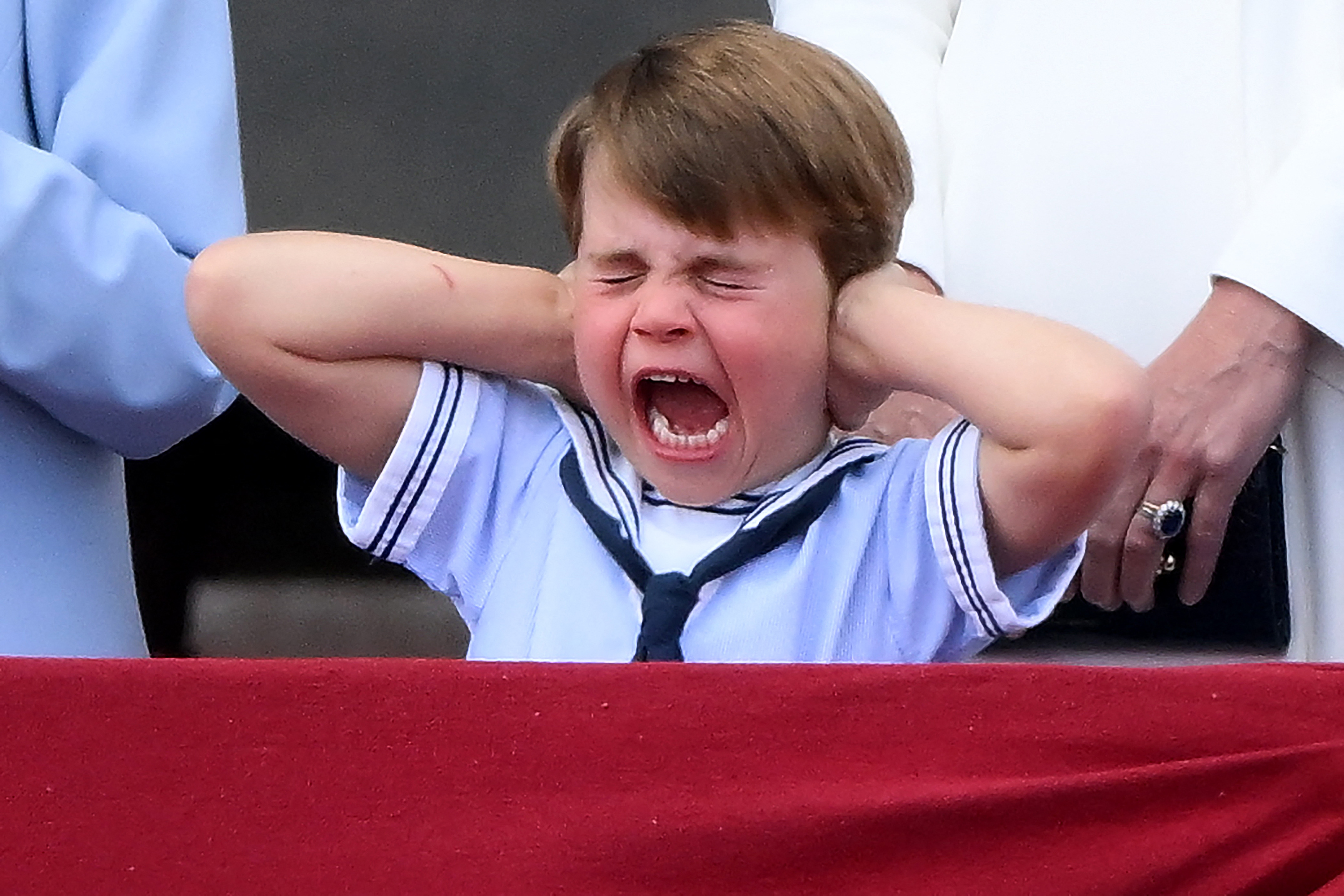 PHOTO: Prince Louis of Cambridge reacts as he watches a special flypast from Buckingham Palace balcony following the Queen's Birthday Parade, the Trooping the Color, as part of Queen Elizabeth II's platinum jubilee celebrations, in London, June 2, 2022.