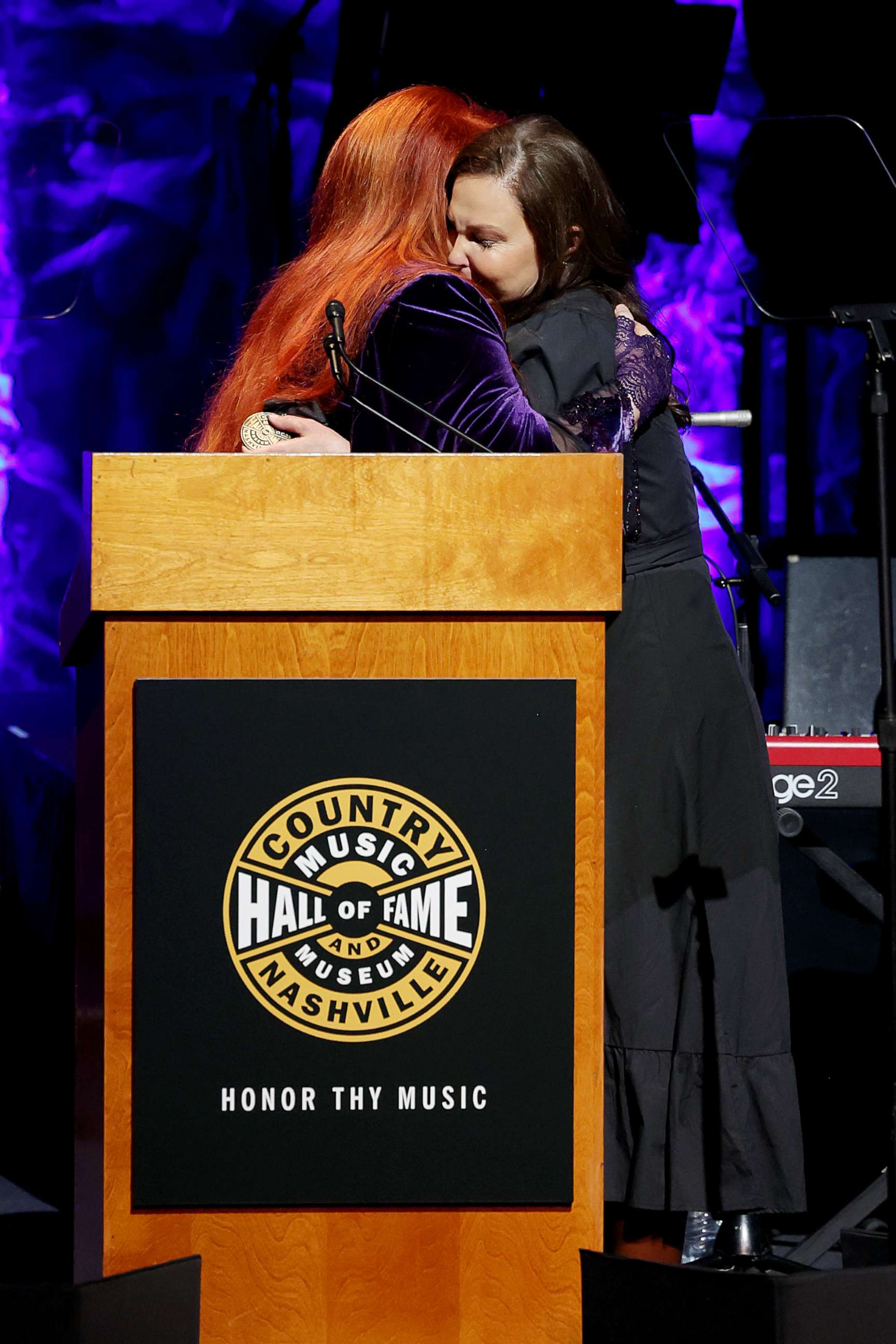 PHOTO: Inductee Wynonna Judd and Ashley Judd speak onstage for the class of 2021 medallion ceremony at Country Music Hall of Fame and Museum on May 1, 2022 in Nashville, Tenn.